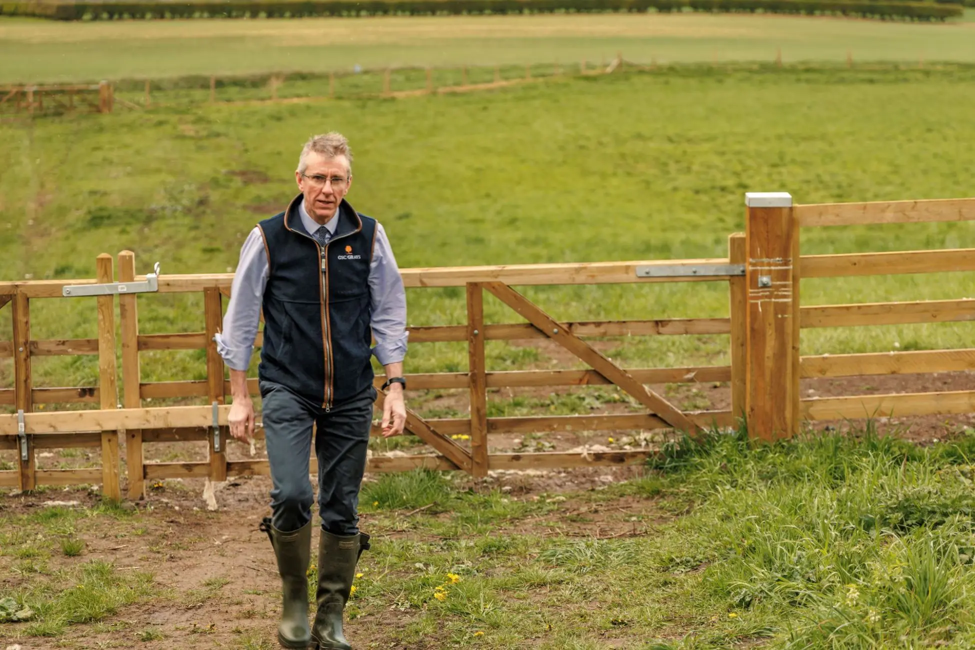 Farm consultant walkign near new farm gate